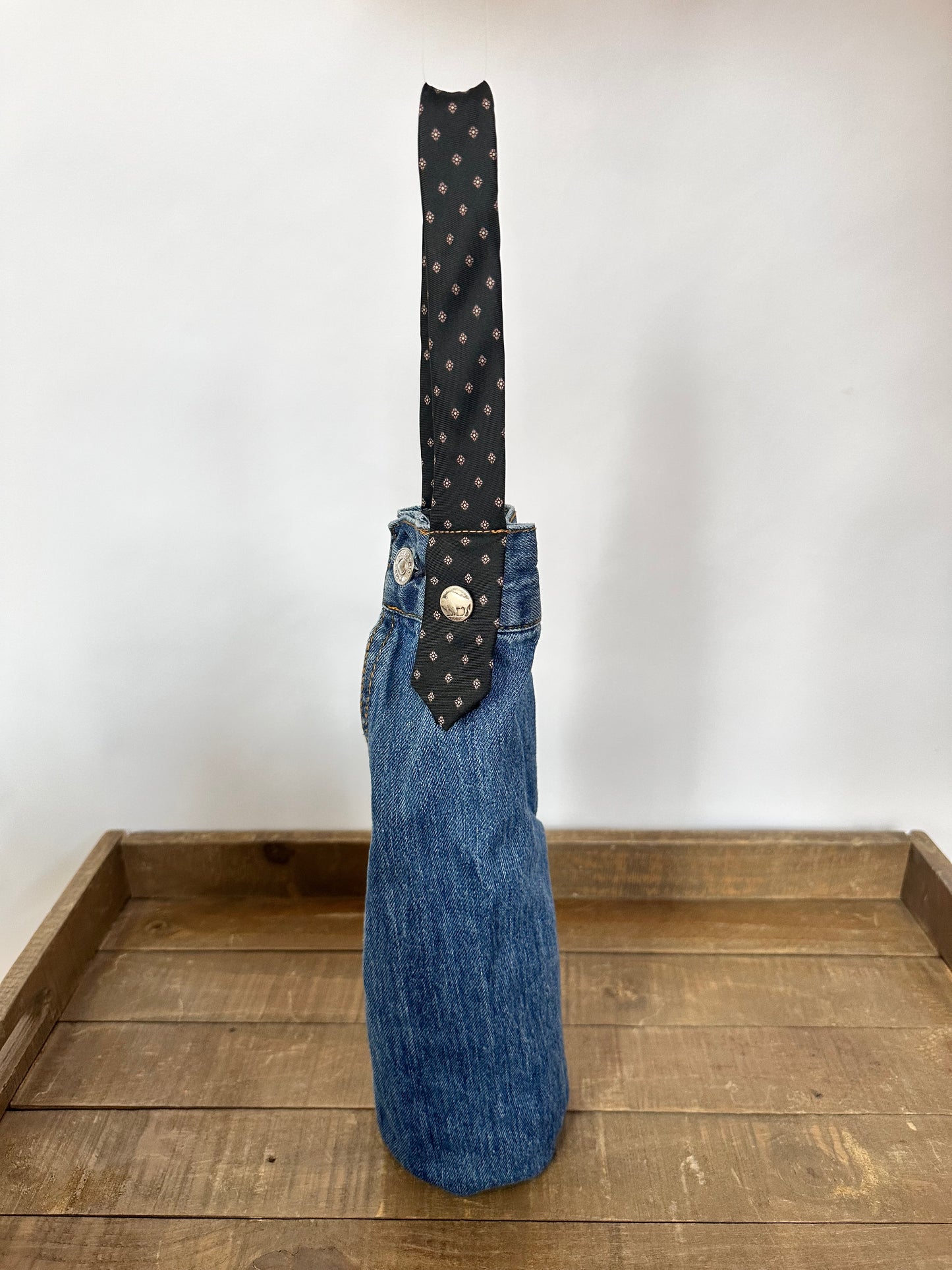 medium wash denim + black diamond tie wine sleeve