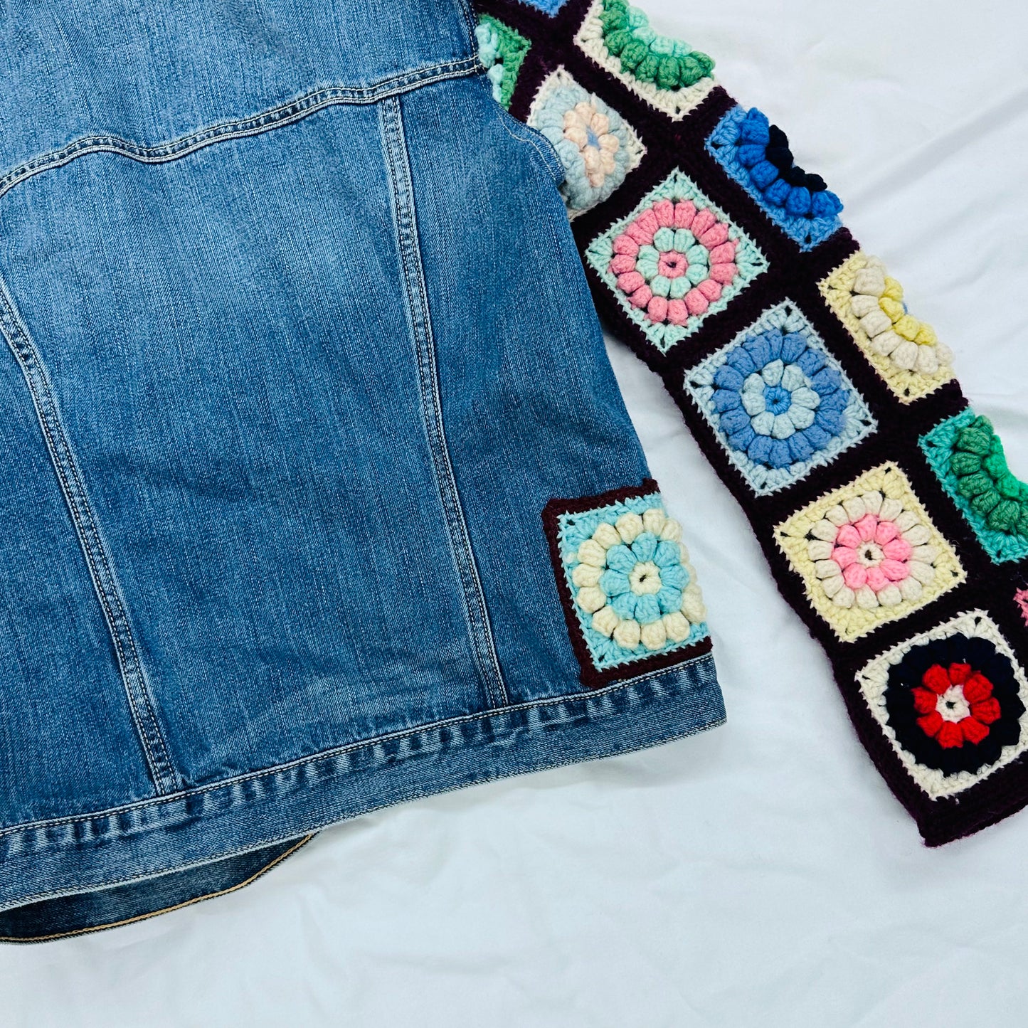 classic denim jacket meets colorful floral crochet