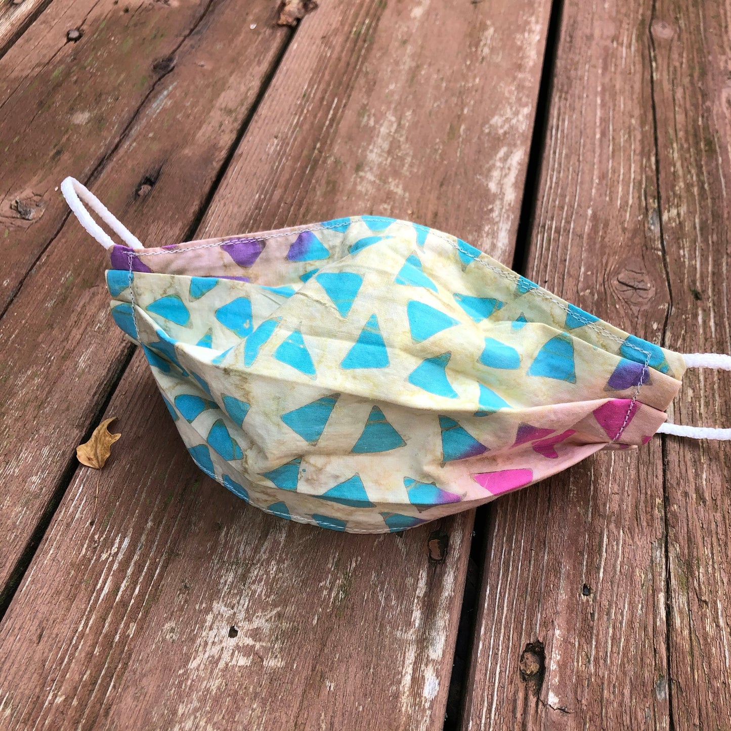 pale yellow with pink, teal + purple confetti face mask