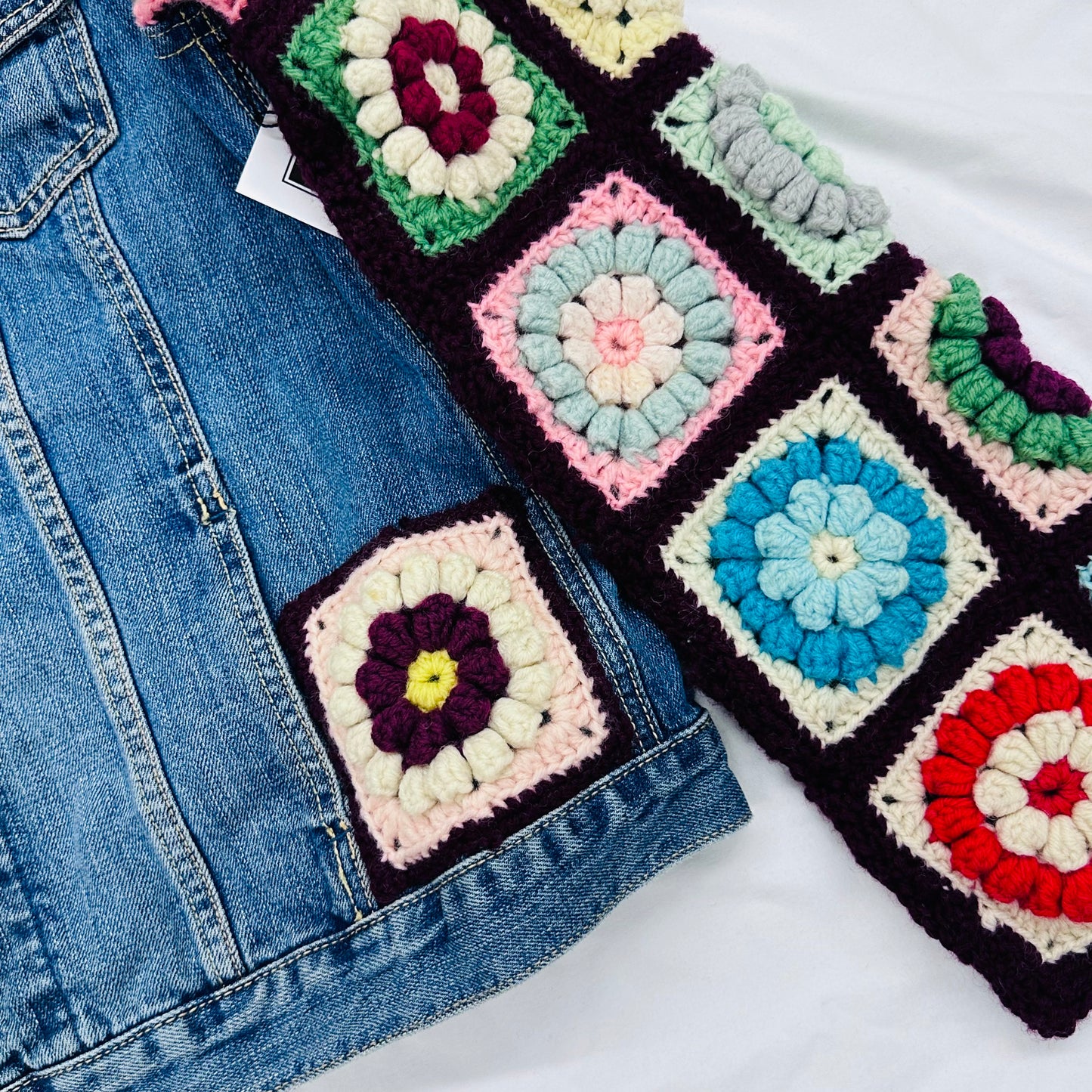 classic denim jacket meets colorful floral crochet