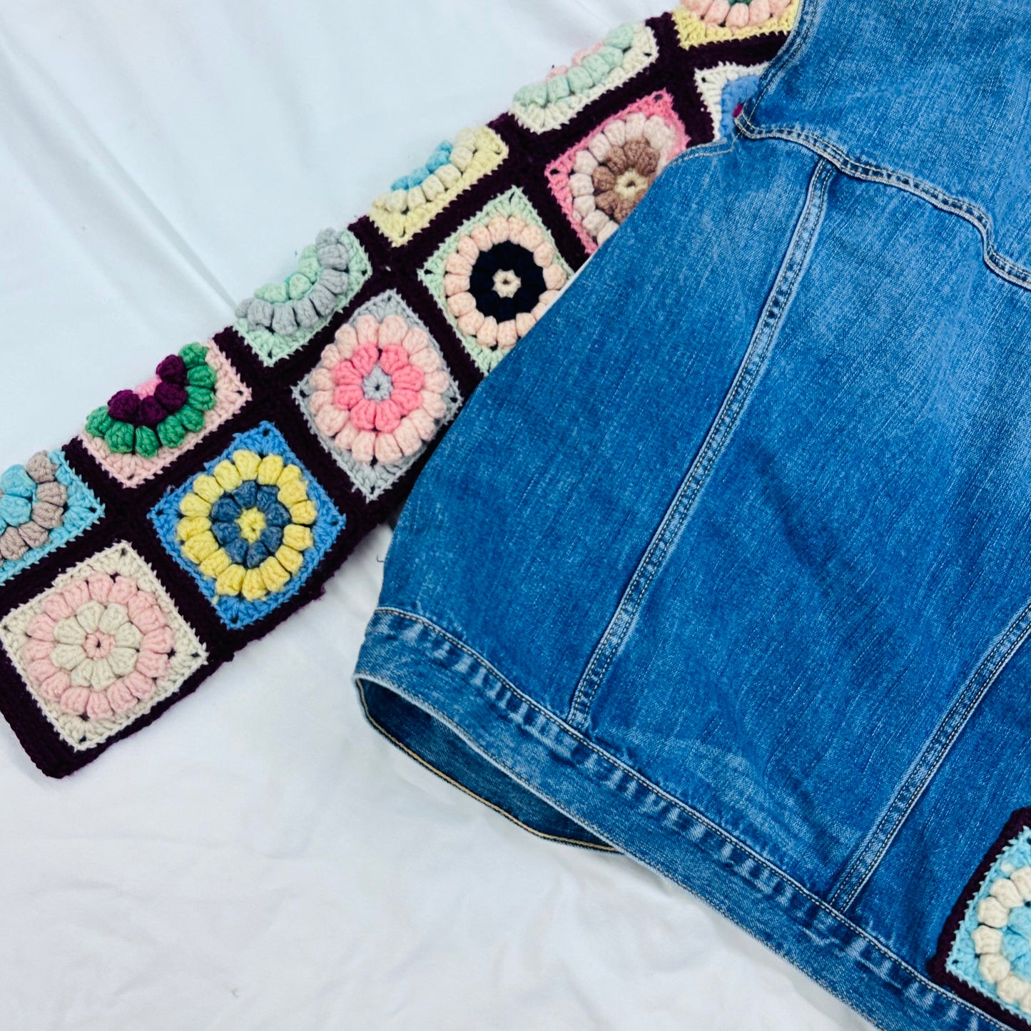 classic denim jacket meets colorful floral crochet