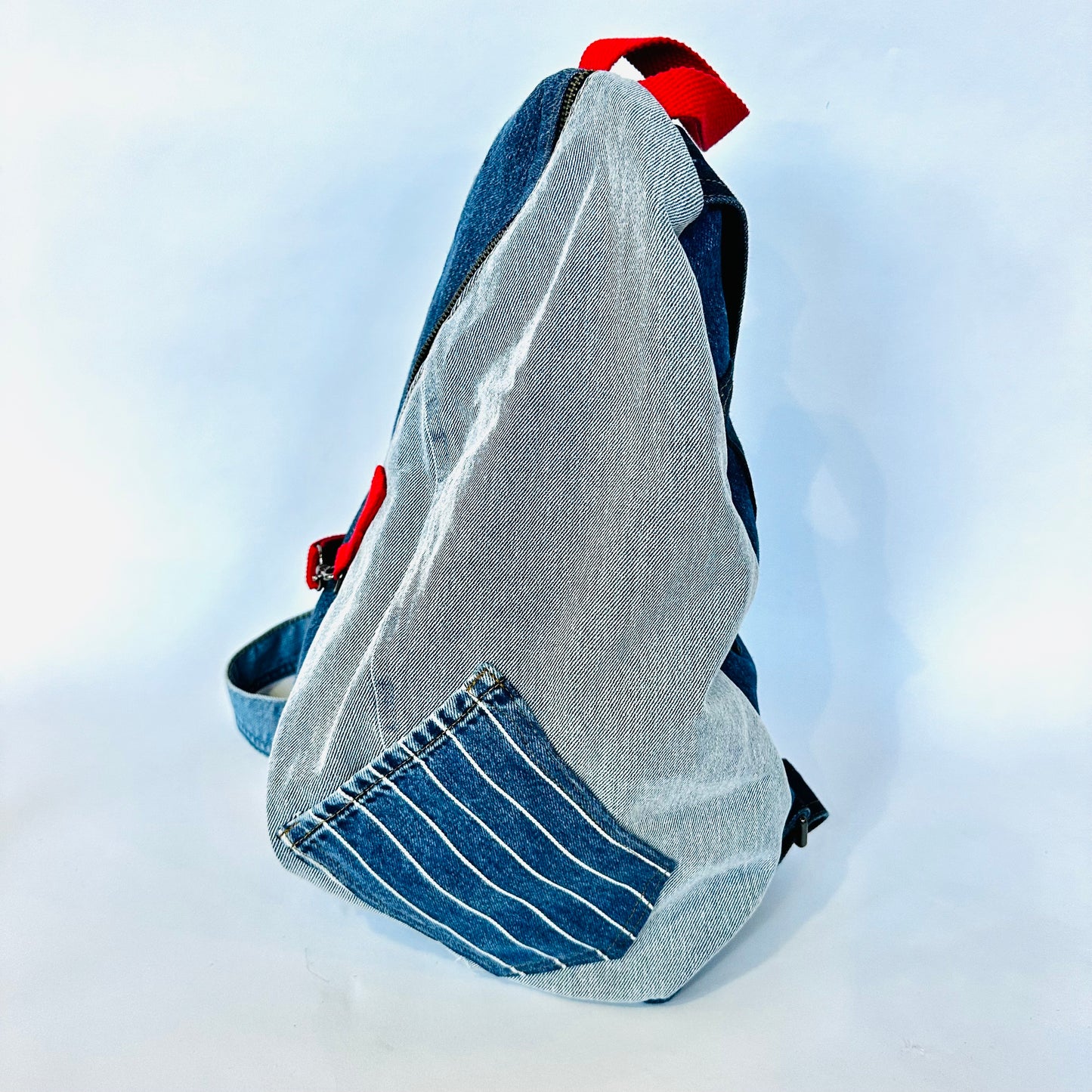 denim sling backpack